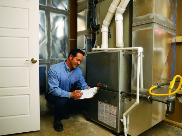 One of our Certified Technicians at Elite Air Inc. in <city>, making sure the job gets done and right the first time.